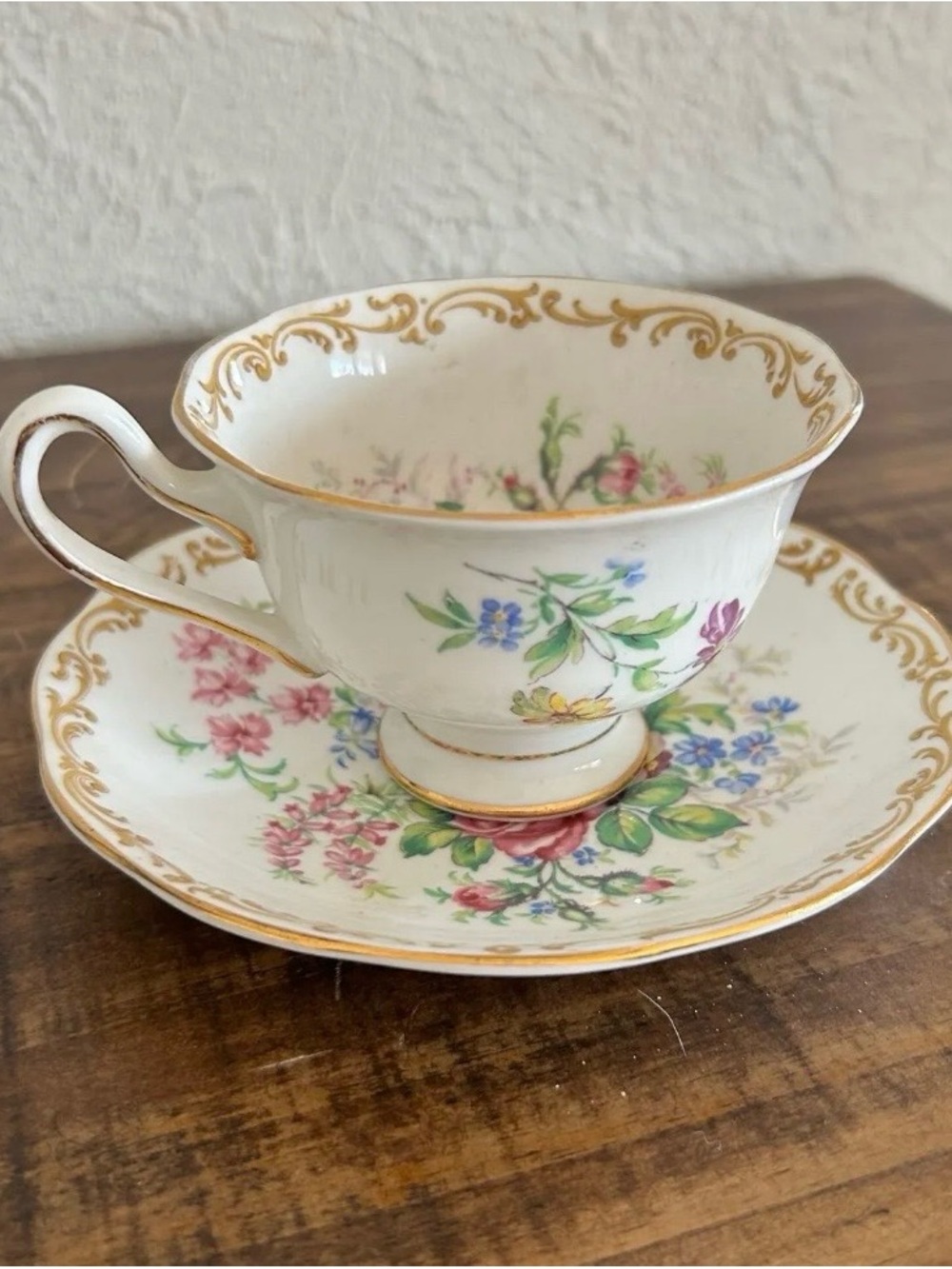Royal Albert White Teacup and Saucer with Gold Trim and Multicolor Floral Design
